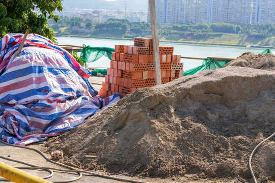 Pile Of Cement And Bricks At Roadside Construction Site