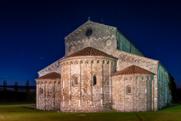 Fototapeta na wymiar Basilica of St. Peter the Apostle in San Piero a Grado, Pisa, Italy, at dusk