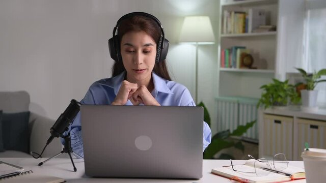 Feeling Good Happy And Positive At Work. Young Asian Businesswoman Wearing Headset On Video Call With Clients On Laptop. Young Asian Woman Giving Online Educational Class Lecture, Consulting Customer.