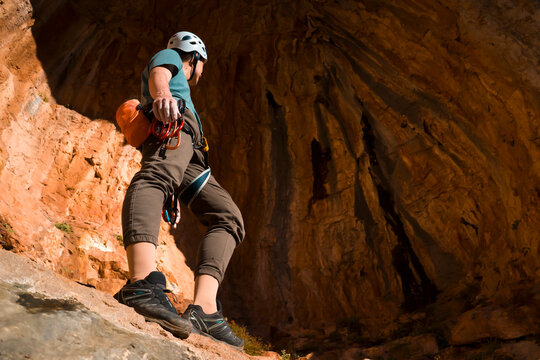 Man is climbing, hiking in the mountains.