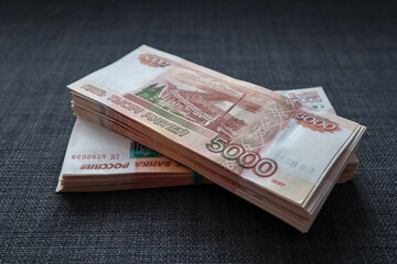 Two wads of money lying on the couch