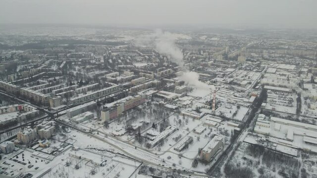 harsh cloudy city in the snow. 4k drone footage