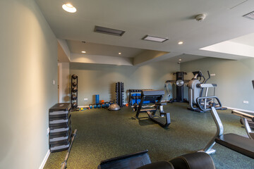 Interior of an empty hotel gym with equipment