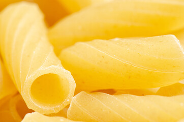 Fototapeta na wymiar Raw ziti pasta. Food background. An ingredient for traditional Italian food. Closeup