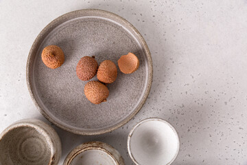 Handmade ceramic tableware, empty craft ceramic on a light background. Clay plates and cups.