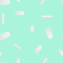 White pills on a colored background. Pattern.