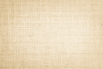 Jute hessian sackcloth burlap canvas woven texture background pattern in light beige cream brown color blank. Natural weaving fiber linen and cotton cloth texture as clean empty for decoration.