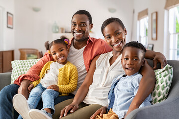 Portrait of happy african american family with son and daughter smiling - Powered by Adobe