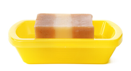 Soap on a plastic soap dish isolated on a white background