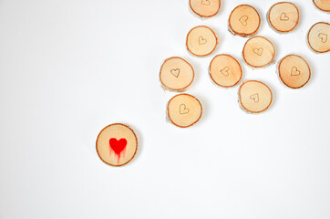 Pine tree slice with red blood heart symbol on white background. Valentines day wallpaper