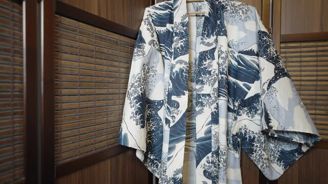 Traditional Japanese male kimono hanging by wooden walls -Close up