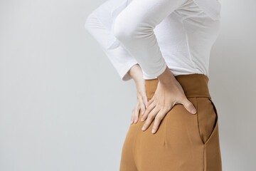 woman suffer from lower back pain, herniated spinal disc, spine displacement