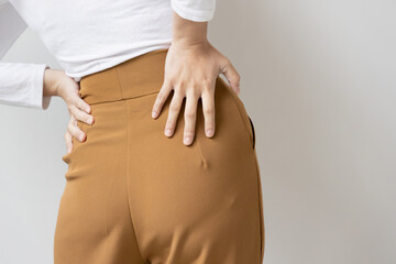 woman suffer from lower back pain, herniated spinal disc, spine displacement