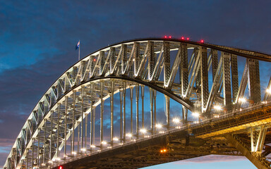 Close-up view of Sydney Harbour Bridge at night.