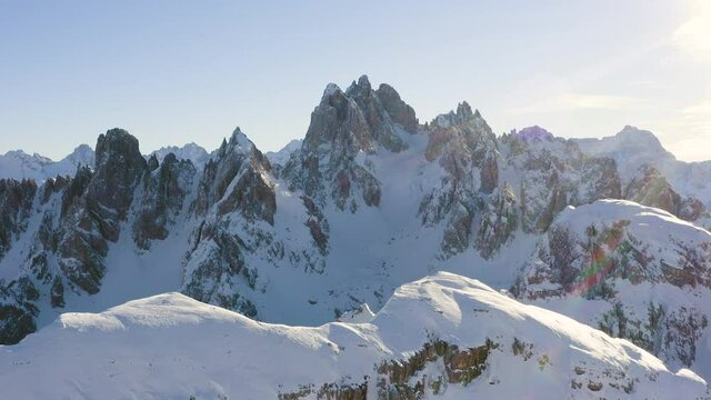 Amazing aerial view of mountains in winter with snow and in a sunny day.