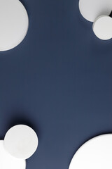 Podiums. White round podiums for presentation. Natural beauty pedestal on blue background. Copy space. Top view.