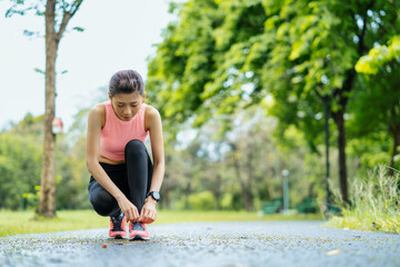 asian young woman stretching in park, lifestyle and health concept.