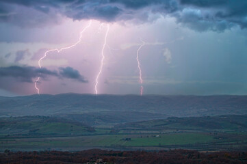 Naklejka na ściany i meble Lightning Strikes from a Storm over the Hills of Tuscany