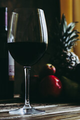 Still life of fruits, flowers and wine.