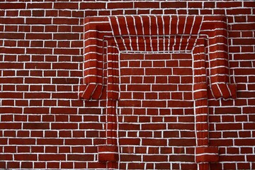 Red brick wall with white painted seams.