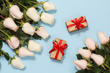 Gift boxes with rose flowers on the blue background.