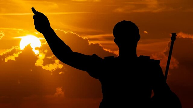 Statue of Roman Emperor Julius Caesa, Time Lapse at Sunset with Red Clouds and Fiery Sky