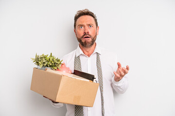 middle age man looking desperate, frustrated and stressed. unemployment concept
