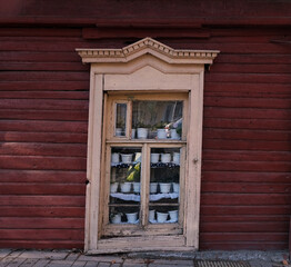 Fototapeta na wymiar window of a wooden house with pots and flowers