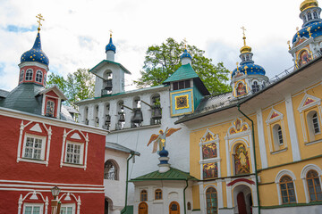 Orthodox shrine. Ancient Russian cities. View of beautiful buildings and Orthodox churches Ancient Pskovo-Pechersky monastery in Pechory, Russia. Travel to Russia. Pilgrimage.