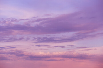 Beautiful sunrise, sunset purple pink violet blue sky with clouds abstract background texture	