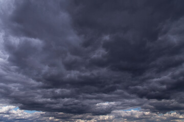 Naklejka na ściany i meble Epic storm sky with many dark grey cumulus rainy clouds background texture, thunderstorm, wind weather