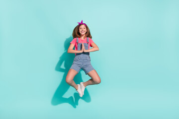 Full size photo of kid girl jump beg new discounts wear striped t-shirt shorts isolated on cyan color background