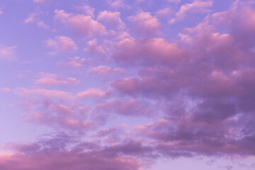 Dramatic sunrise, sunset pink violet blue sky with beautiful clouds background texture