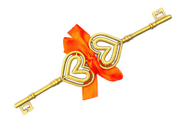 Two keys tied with a ribbon bow on a neutral background