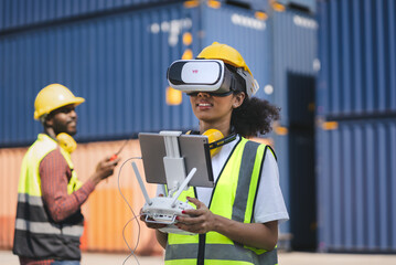 Engineering businesswoman play drone of remote control and vr glasses with blue containers...