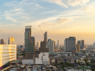 Obraz premium Aerial view of Bangkok Downtown Skyline, Thailand. Financial district and business centers in smart urban city in Asia. Skyscraper and high-rise buildings at sunset.