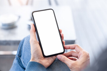 cell phone blank white screen mockup.hand holding texting using mobile on desk at office.background empty space for advertise.work people contact marketing business,technology