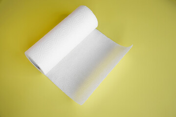 Absorbent paper napkin kitchen towels on yellow background.