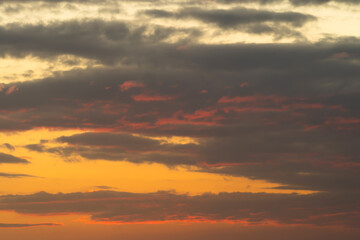 Sunset sky. Abstract nature background. Dramatic blue with orange colorful clouds in twilight time.