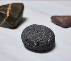 Volcanic stone. Small black stone of volcanic origin