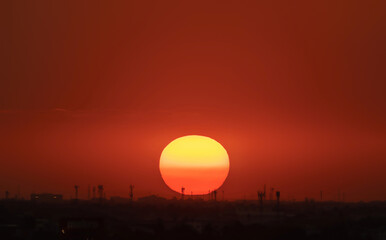 The Sun with sunset sky. Abstract nature background. Dramatic blue with orange colorful clouds in twilight time.