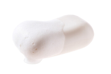 A bar of soap with foam isolated on a white background. - obrazy, fototapety, plakaty