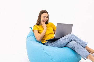 Photo of young beautiful attractive happy amazed woman working in laptop sit armchair isolated on white background