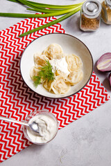 Traditional Russian food dumplings, ravioli, pelmeni in a bowl