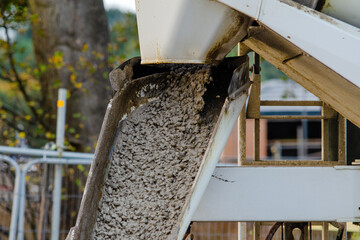 Wet ready mix concrete delivered on construction site and discarged of the vagon