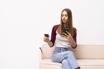 Portrait beautiful young woman use smart mobile phone or laptop with credit card on sofa in living room area