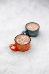 Coffee cup with cream or milk, top view on beautiful white snow background. Great picture for baner or menu