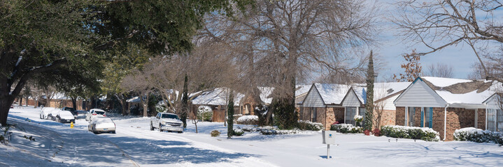 Panoramic cold sunny day after a heavy snow storm historic blizzard in residential street near...