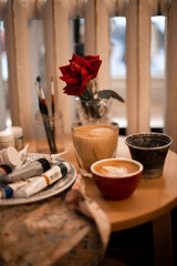 Painter work space with cups of coffee. Art scene.