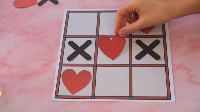 Valentine's day concept with hearts X-O game. Top view. Video